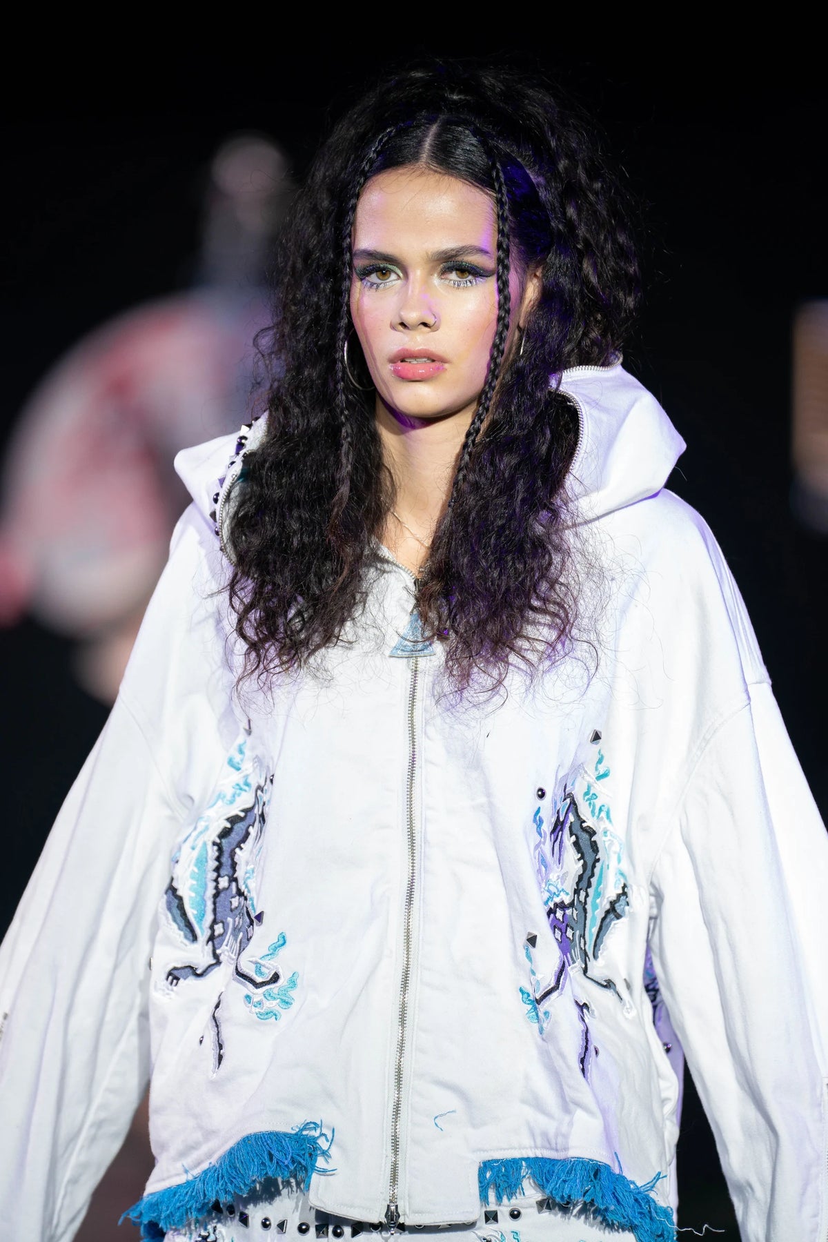The white denim hooded jacket in close detail on the Denver runway